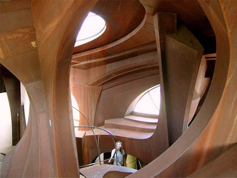http://cdn.dornob.com/wp-content/uploads/2009/02/steel-curved-futuristic-home-design.jpg