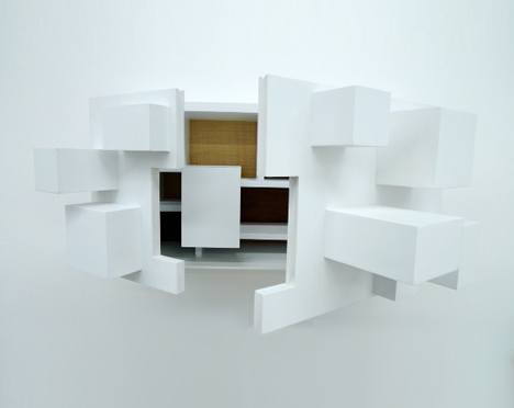 imploding white cabinet design